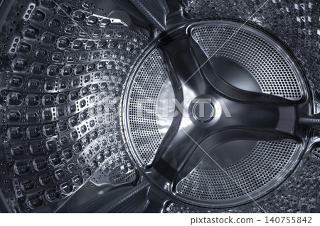 Inside of the washing machine drum . Inside of the washing machine drum . 140755842