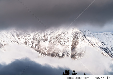 A breathtaking view of Kluane National Park, with its snow-capped mountains and clouds, as seen from Haines Junction in Yukon Territory, Canada. (Tourist attraction) A breathtaking view of Kluane National Park, with its snow-capped mountains and clouds, as seen from Haines Junction in Yukon Territory, Canada. (Tourist attraction) 140755912