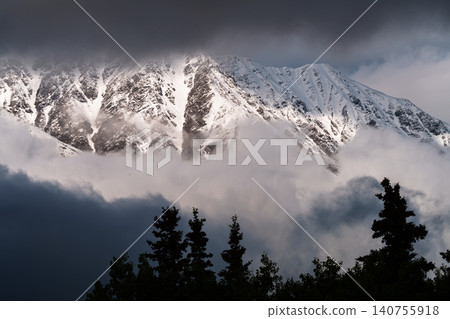 A breathtaking view of Kluane National Park, with its snow-capped mountains and clouds, as seen from Haines Junction in Yukon Territory, Canada. (Tourist attraction) A breathtaking view of Kluane National Park, with its snow-capped mountains and clouds, as seen from Haines Junction in Yukon Territory, Canada. (Tourist attraction) 140755918