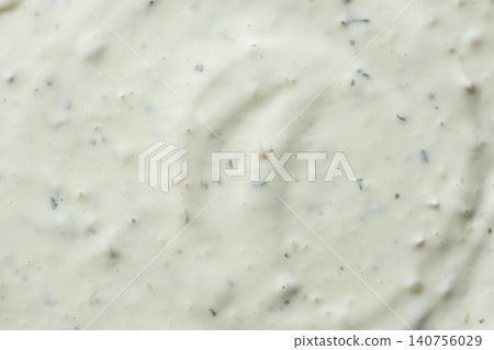 Close-up texture of creamy tartar sauce with herbs top view Close-up texture of creamy tartar sauce with herbs top view 140756029