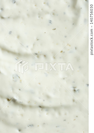 Close-up texture of creamy tartar sauce with herbs top view 140756030