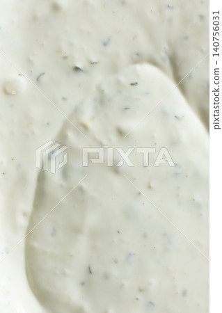 Close-up texture of creamy tartar sauce with herbs top view Close-up texture of creamy tartar sauce with herbs top view 140756031