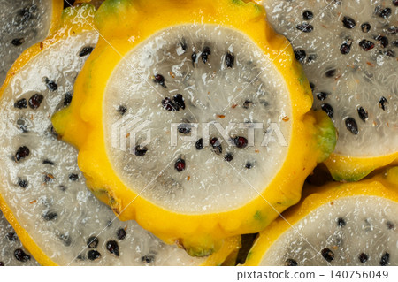 Slices of yellow dragon fruit texture background top view Slices of yellow dragon fruit texture background top view 140756049