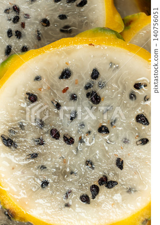 Slices of yellow dragon fruit texture background top view Slices of yellow dragon fruit texture background top view 140756051