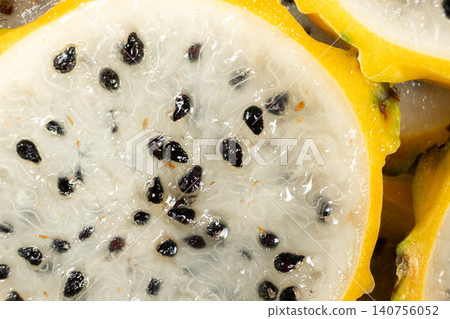 Slices of yellow dragon fruit texture background top view Slices of yellow dragon fruit texture background top view 140756052