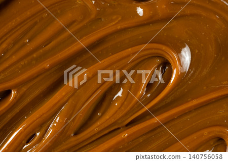Swirling dulce de leche pattern close up for dessert. Swirling dulce de leche pattern close up for dessert. 140756058