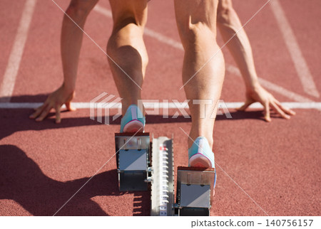 Back view of male feet on starting block ready for a sprint start Back view of male feet on starting block ready for a sprint start 140756157