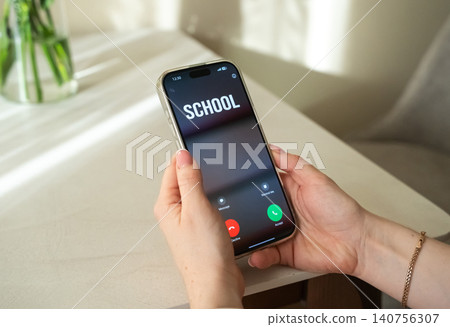 Mom gets a call from school about an incident or a student's misbehavior. Raising children. Bullying at school. Mom gets a call from school about an incident or a student's misbehavior. Raising children. Bullying at school. 140756307