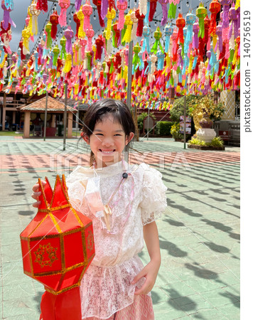 Cute asian girl with Thai dress at Lantern Yi Peng Festival Cute asian girl with Thai dress at Lantern Yi Peng Festival 140756519