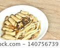 stir fried mixed mushroom topping black mushroom in garlic and pepper gravy soy sauce on plate 140756739