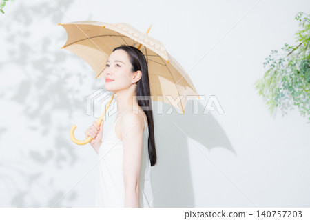 A woman holding a parasol A woman holding a parasol 140757203
