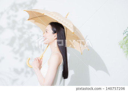 A woman holding a parasol A woman holding a parasol 140757206