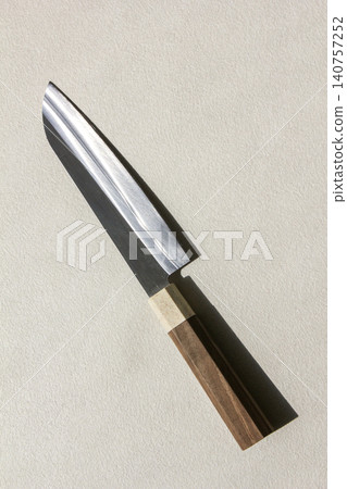 It is a kitchen knife placed against a white background. It is a kitchen knife placed against a white background. 140757252