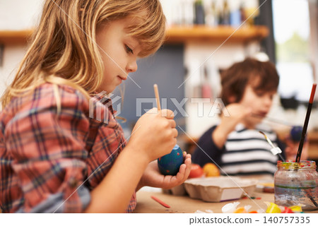 Child, paint and brushing egg with colorful art for learning, education or creativity at home. Young girl enjoying color, activity or artwork in early childhood development with sibling at the house Child, paint and brushing egg with colorful art for learning, education or creativity at home. Young girl enjoying color, activity or artwork in early childhood development with sibling at the house 140757335