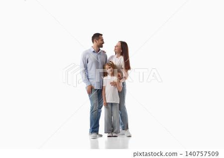 Happy parents standing with young daughter on white studio background. Happy parents standing with young daughter on white studio background. 140757509