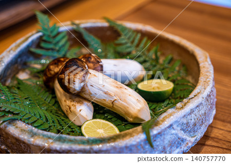 [#Gourmet] Matsutake mushrooms and sudachi citrus arranged on a plate 140757770