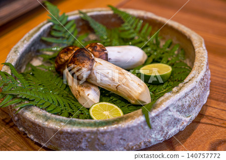 [#Gourmet] Matsutake mushrooms and sudachi citrus arranged on a plate 140757772