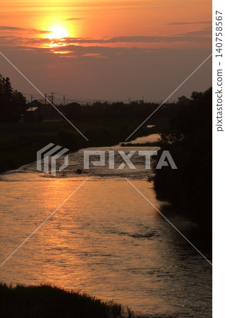 Sunset reflected on the river Sunset reflected on the river 140758567