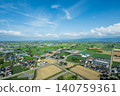 A breathtaking view of scattered settlements spread across the Tonami Plain in Oyabe City, Toyama Prefecture in May. 140759361