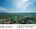 A breathtaking view of the river flowing through the Tonami Plain and scattered villages in Oyabe City, Toyama Prefecture in May. 140759367