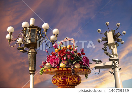 Street lamp and huge flower basket (against the sunset) in Tiananmen square, Beijing, China    140759389