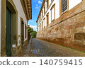 Street between historic buildings 140759415
