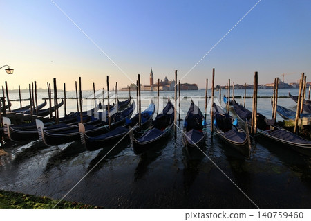 Italy, Venice Old Town, San Giorgio Maggiore Island as seen from the San Marco district in the early morning. Italy, Venice Old Town, San Giorgio Maggiore Island as seen from the San Marco district in the early morning. 140759460