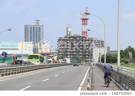 Summer in Arakawa: At Shin-Arakawa Bridge (looking towards Kawaguchi) Summer in Arakawa: At Shin-Arakawa Bridge (looking towards Kawaguchi) 140759505