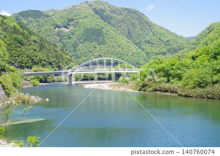 The scenery of the Ota River in Asakita Ward, surrounded by fresh greenery. The scenery of the Ota River in Asakita Ward, surrounded by fresh greenery. 140760074