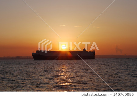 Sunrise over a ship anchored in Tokyo Bay Sunrise over a ship anchored in Tokyo Bay 140760096