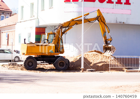 Construction workers preparing site before sidewalk paving. Urban construction scene. Developing city for new pedestrian paths 140760459