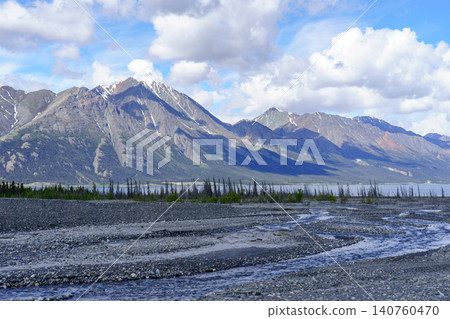 Kluane National Park, Yukon Territory, Canada: A magnificent natural landscape encompassing the Kluane Mountains and Kluane Lake. A popular tourist attraction. Kluane National Park, Yukon Territory, Canada: A magnificent natural landscape encompassing the Kluane Mountains and Kluane Lake. A popular tourist attraction. 140760470