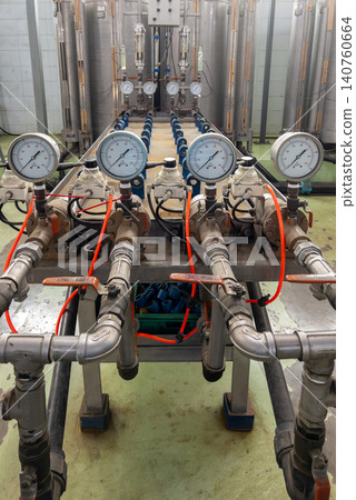 Industrial water filtration system with pressure gauges and pipes. Industrial water filtration system with pressure gauges and pipes. 140760664