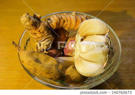 Fresh Traditional Indonesian Spices and Tamarind in Glass Bowl on Wooden Table Fresh Traditional Indonesian Spices and Tamarind in Glass Bowl on Wooden Table 140760673