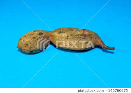 Tamarind Pod Isolated on Blue Background 140760675