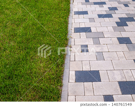 Illusion of separation with a green lawn and a park path texture composition 140761549