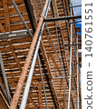 Industrial geometry of wooden scaffold planks on a building facade rhythm composition 140761551