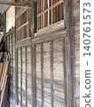 The wall of an old wooden building 140761573