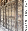 The wall of an old wooden building 140761574