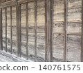 The wall of an old wooden building 140761575