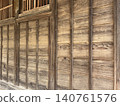 The wall of an old wooden building 140761576