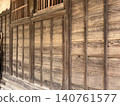 The wall of an old wooden building 140761577