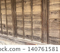 The wall of an old wooden building 140761581