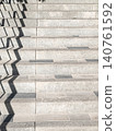 Abstract geometry of a handrail shadow on a stone staircase rhythmic composition 140761592