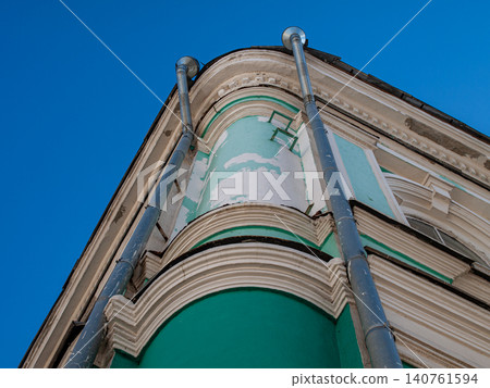 Abstract geometry of downspout pipes on a building facade restoration for art poster Abstract geometry of downspout pipes on a building facade restoration for art poster 140761594