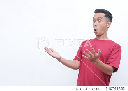 Man wears red tee, shocked expression. Hands raised, mouth open wide. Pure astonishment, dramatic surprise. Studio shot, clean white background. Perfect for reaction, shock, or disbelief scenes Man wears red tee, shocked expression. Hands raised, mouth open wide. Pure astonishment, dramatic surprise. Studio shot, clean white background. Perfect for reaction, shock, or disbelief scenes 140761862