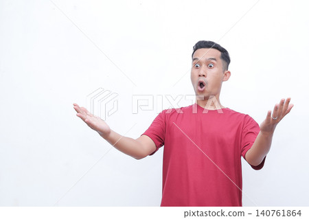 Man wears red tee, shocked expression. Hands raised, mouth open wide. Pure astonishment, dramatic surprise. Studio shot, clean white background. Perfect for reaction, shock, or disbelief scenes Man wears red tee, shocked expression. Hands raised, mouth open wide. Pure astonishment, dramatic surprise. Studio shot, clean white background. Perfect for reaction, shock, or disbelief scenes 140761864