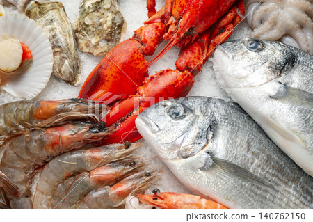 Fresh fish and seafood on ice, closeup Fresh fish and seafood on ice, closeup 140762150