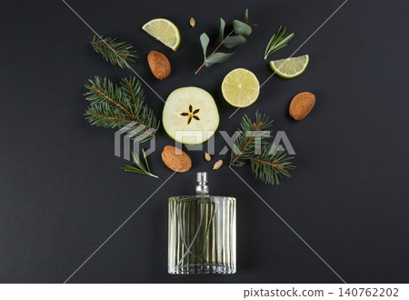 Flat lay composition with bottle of perfume on black background Flat lay composition with bottle of perfume on black background 140762202