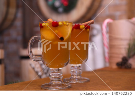 Tasty aromatic mulled wine on wooden table 140762280